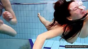 Shaved big-titted brunette teases tight pussy in underwater shower