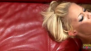 businessman rams blonde babe's shaved pussy in red fishnets on sofa