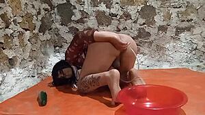 Ts Pees in Ass Stretches Gaping Hole with Cucumber