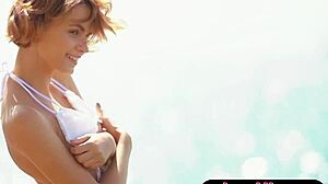Petite Ukrainian blonde milf bares small tits on sunny beach