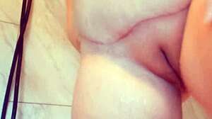 Wet milf rubs big tits in soaked shower