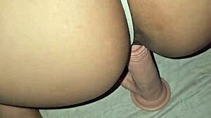 Double penetration with dildo and cock inside
