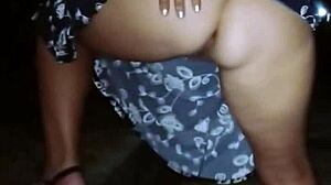 Milf pisses outdoors on a public street while wet