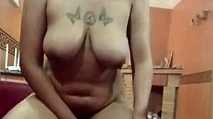 linda eats cucumber with her big tits out