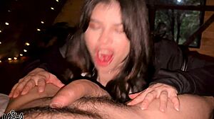 brunette swallows every drop in dark cabin