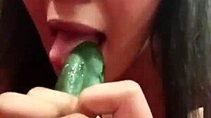 linda eats cucumber with her big tits out