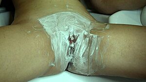 shaving pussy closeup with trimmer