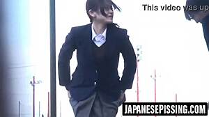 cute japanese girl pees on bathroom floor then cleans