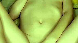 girl in white lingerie fucks herself with pink dildo
