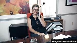 Busty blonde milf rubs her wet pussy at work desk