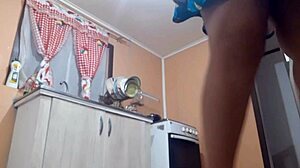 Chubby housewife enjoys doing housework in the kitchen