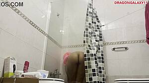 stepsister takes a shower in the bathroom