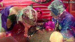 a bizarre bisexual threesome of latex fans looks almost surreal