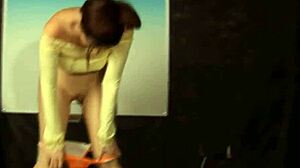 Brunette rips hippy outfit during striptease