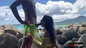 young couple fucking hot on a public beach overlooking the sea