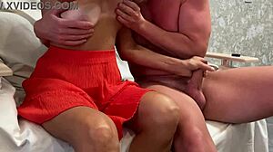 Mature cougar strokes a big cock with her hands during free use play.