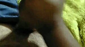 mature couple enjoys cumshot handjob on big cock while watching netflix