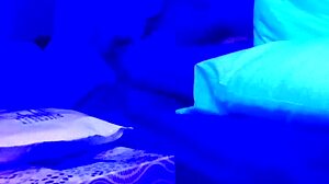 Amateur couple explores blacklight pleasure
