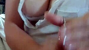 Detailed Handjob on Tits Leading to Cumshot