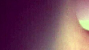 Busty amateur performs for the camera